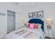 bedroom with a blue headboard and fun decor at 638 Teviot Rd, Haines City, FL 33844