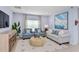 Cozy living room featuring light-colored sofas and a large piece of art at 638 Teviot Rd, Haines City, FL 33844