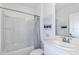 Clean bathroom with tub, shower, and vanity at 638 Teviot Rd, Haines City, FL 33844
