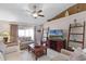 Spacious living room with comfortable seating and large TV at 806 Knightsbridge Cir, Davenport, FL 33896