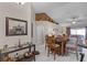 Charming dining area with wood table and chairs near living room at 806 Knightsbridge Cir, Davenport, FL 33896