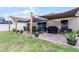 Large backyard with patio, shade sail and grill at 806 Knightsbridge Cir, Davenport, FL 33896