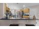 Kitchen with breakfast bar and modern cabinetry at 806 Knightsbridge Cir, Davenport, FL 33896