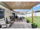 Backyard patio with shaded seating area and grill at 806 Knightsbridge Cir, Davenport, FL 33896