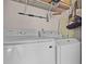 Laundry room with washer, dryer and shelving at 806 Knightsbridge Cir, Davenport, FL 33896