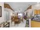 Bright dining area with wood table and chairs, adjacent to kitchen at 806 Knightsbridge Cir, Davenport, FL 33896