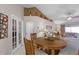 Elegant dining area featuring a round wood table and comfortable chairs at 806 Knightsbridge Cir, Davenport, FL 33896