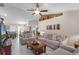 Spacious living room with tile floors, neutral color palette, and ample seating at 806 Knightsbridge Cir, Davenport, FL 33896