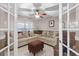 Bright office space with french doors and comfortable seating at 806 Knightsbridge Cir, Davenport, FL 33896