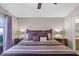King-size bedroom with dark wood furniture and sliding door to patio at 806 Knightsbridge Cir, Davenport, FL 33896