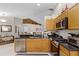 Spacious kitchen with stainless steel appliances and granite countertops at 806 Knightsbridge Cir, Davenport, FL 33896