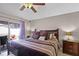 Spacious main bedroom with king bed, wood furniture and backyard access at 806 Knightsbridge Cir, Davenport, FL 33896