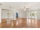 Bright bedroom with hardwood floors and mirrored closet doors at 9792 Wild Oak Dr, Windermere, FL 34786