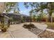 Large backyard with pool, screen enclosure, and basketball hoop at 9792 Wild Oak Dr, Windermere, FL 34786