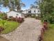 Two-story house with brick driveway and landscaping at 9792 Wild Oak Dr, Windermere, FL 34786