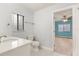 Clean bathroom with white vanity, toilet, and window at 9792 Wild Oak Dr, Windermere, FL 34786