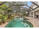 Relaxing screened pool and spa area at 9792 Wild Oak Dr, Windermere, FL 34786