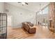 Living room with vaulted ceiling, stone fireplace, and access to backyard pool at 9792 Wild Oak Dr, Windermere, FL 34786
