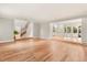 Spacious living room with hardwood floors and views to kitchen and entry at 9792 Wild Oak Dr, Windermere, FL 34786