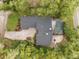 Aerial view showing house, landscaping, pool, and driveway at 9792 Wild Oak Dr, Windermere, FL 34786
