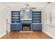 Living room with blue built-in shelving and fireplace at 9792 Wild Oak Dr, Windermere, FL 34786