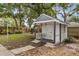 Charming backyard shed with a small porch and ramp at 9792 Wild Oak Dr, Windermere, FL 34786