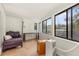Peaceful sunroom with tiled floor, seating area, and natural light at 9792 Wild Oak Dr, Windermere, FL 34786