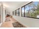 Bright screened porch with tile floors and ample natural light at 9792 Wild Oak Dr, Windermere, FL 34786