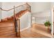 Elegant entryway with hardwood floors and staircase at 9792 Wild Oak Dr, Windermere, FL 34786
