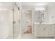 Modern bathroom with white vanity, large shower, and tiled floor at 9792 Wild Oak Dr, Windermere, FL 34786