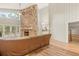 Spacious living room featuring a stone fireplace and hardwood floors at 9792 Wild Oak Dr, Windermere, FL 34786