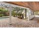 Relaxing pool area with covered patio and brick pavers at 9792 Wild Oak Dr, Windermere, FL 34786