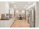 Modern kitchen with white cabinets, wood countertops, and stainless steel appliances at 9792 Wild Oak Dr, Windermere, FL 34786
