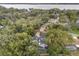 Aerial view showcasing house, landscape, and waterfront at 9792 Wild Oak Dr, Windermere, FL 34786
