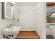 Small pool bathroom with shower, sink, and access to the pool area at 9792 Wild Oak Dr, Windermere, FL 34786
