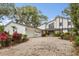 Two-story home with stone accents and a paver driveway at 9792 Wild Oak Dr, Windermere, FL 34786