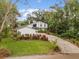 Two-story house with landscaping and brick driveway at 9792 Wild Oak Dr, Windermere, FL 34786