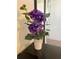 Purple hydrangea in a white vase on a dresser at 1572 Flange Dr, Davenport, FL 33896