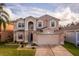 Two-story house with a two-car garage at 2657 W Dover Glen Cir, Orlando, FL 32828