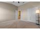 Well-lit bedroom with double-door closet and access to a bathroom at 506 Rainbow Springs Loop, Groveland, FL 34736