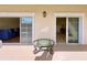 Private patio with glass-top table and sliding glass doors at 7612 Cabana Ct # 303, Reunion, FL 34747