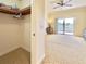 Walk-in closet with shelving and hanging rods at 7612 Cabana Ct # 303, Reunion, FL 34747