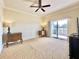 Spacious bedroom with balcony access and ceiling fan at 7612 Cabana Ct # 303, Reunion, FL 34747