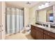 Clean bathroom with shower/tub combo, granite vanity, and updated fixtures at 7612 Cabana Ct # 303, Reunion, FL 34747