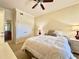 Guest bedroom with double closet and ceiling fan at 7612 Cabana Ct # 303, Reunion, FL 34747