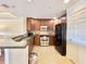 Modern kitchen with stainless steel appliances and granite countertops at 7612 Cabana Ct # 303, Reunion, FL 34747