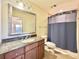 Bathroom with granite vanity, shower, and updated fixtures at 7612 Cabana Ct # 303, Reunion, FL 34747