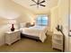 Comfortable bedroom with window and ceiling fan at 7612 Cabana Ct # 303, Reunion, FL 34747