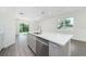 Modern kitchen island with seating and stainless steel appliances at 174 14Th Avenue, Longwood, FL 32750