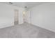 Bright bedroom with grey carpet and en-suite bathroom at 174 14Th Avenue, Longwood, FL 32750